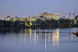 Copyspace Prints: The Saint-Boniface Hospital reflecting in the Red River in Winnipeg, Manitoba, Canada
