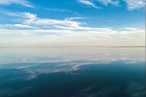 Images Dated 13th September 2020: Salt lake water under blue sky with fluffy clouds in summer day. Creative color concept