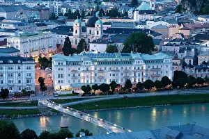Salzburg Prints: Salzburg, Austria, Europe. View across Salzach River to historic waterfront buildings and Grand Hotel Sacher Salzburg