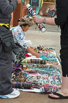 San Diego Prints: San Diego, California - Street vendors sell jewelry to tourists on the sidewalk at Seaport Village in downtown San