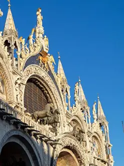 Gothic Style Prints: San Marco Basilica facade with St. Mark statue, the winged lion and the horses, Venice