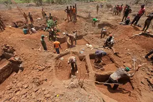 Polluting Prints: Sanana gold mine, Guinea, 2nd May 2015; Miners digging their plots in the dry-season heat