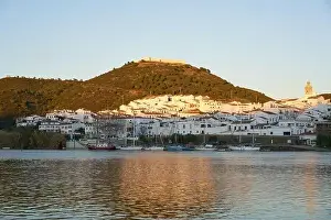 Town Hill Prints: Sanlucar de Guadiana in Spain and Alcoutim in Portugal with sail boats on Guadiana river