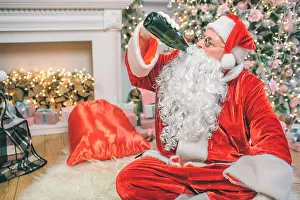 Christmas Tree Prints: Santa Claus sits on floor and drinks alcohol from bottle