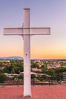 Images Dated 23rd June 2019: Santa Fe, New Mexico, USA cross and downtown skyline at dusk