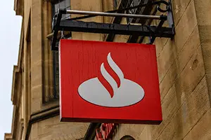 Shop Front Prints: Santander bank logo sign on Cornmarket Street, Oxford, Oxfordshire, UK. Feb 2018