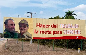 Santiago Prints: Santiago Cuba billboard of Fidel Castro and Raul Castro for Revolution saying 'Work is the way to Overcome'