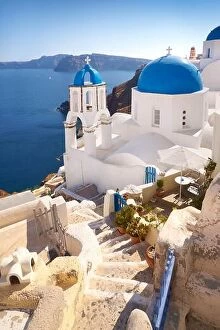 Images Dated 17th June 2011: Santorini Caldera landscape with greek white church overlooking the sea, Oia Town