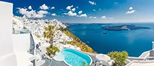 Santorini, Greece landscape, pool caldera view with flowers blue doors. Romantic couple destination with sunny sky, wonderful summer hotel resort