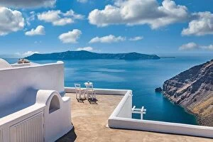 Images Dated 11th May 2019: Santorini island caldera view with chairs and white architecture, romantic mood