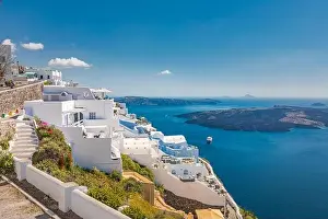 Santorini Island, filled with cafes and hotels overlooking the Aegean Sea and volcanic Caldera. Luxury summer travel and vacation destination of white