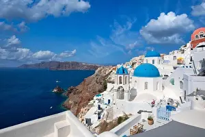 Santorini island, Greece. Incredibly panoramic romantic summer landscape on Santorini. Oia village in the morning light. Amazing view with white house
