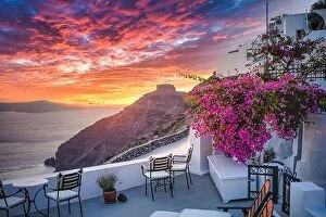 Images Dated 23rd July 2021: Santorini island sunset. Caldera view with chairs and flowers, romantic mood