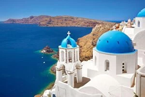 Images Dated 27th June 2011: Santorini landscape with greek bell tower and white church with blue dome overlooking the sea