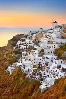 Images Dated 16th June 2011: Santorini - view of Oia Town and windmills at sunset time, Greece