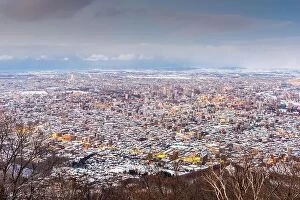 Images Dated 19th February 2017: Sapporo, Japan winter skyline view from the mountains at dusk