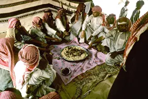 Tent Prints: Saudi Arabia Empty Quarter. Al Murrah Bedouin wait for the start signal to dig into the camel meat and rice
