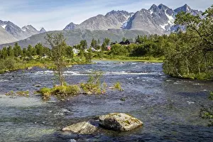 Angling Prints: Scandinavian landscape with rapids in a river and a glacier in the background on the island Lyngen in Norway