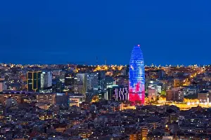 Scenic aerial view of Barcelona city skyscraper and skyline at night in Barcelona, Spain