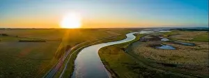 Agricultural Land Prints: Scenic agricultural countryside landscape at sunset - aerial panorama