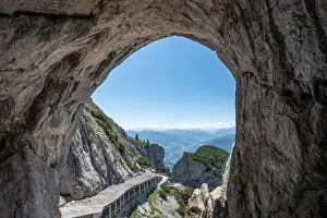 Cavern Prints: Scenic cave landscape with mountains and blue sky at bright summer day in Werfen