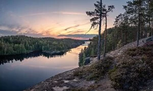 Images Dated 10th August 2019: Scenic forest landscape with tranquil mood and idyllic sunset at summer evening in Finland