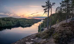 Forest Lake Prints: Scenic forest landscape with tranquil mood and idyllic sunset at summer evening in Finland