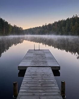Images Dated 29th September 2018: Scenic and idyllic lake landscape with pier and fog at autumn morning in Finland