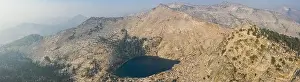 A scenic lake is found amid the wilderness of the Sierra Nevada Mountains. These beautiful granite mountains run along the eastern edge of California