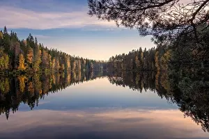 Scenic lake landscape with reflections and calm weather at autumn evening in Finland