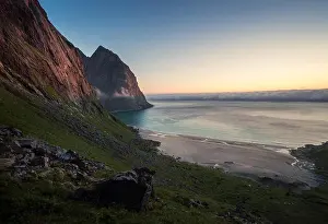 Scenic landscape with beach and mountain at bright summer night in Lofoten Islands, Norway