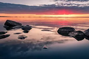 Scenic landscape with beautiful sunset and lake at spring evening in national park
