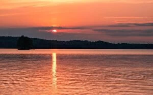 Images Dated 19th June 2019: Scenic landscape with beautiful sunset and lake at summer evening in Finland