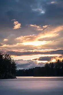 Scenic landscape with dramatic sky and sunset at evening in Finland