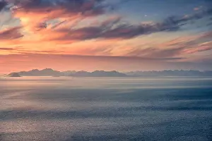 Scenic landscape with golden sunset and mountains at summer night in Lofoten, Norway