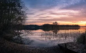 Scenic landscape with sunset and lake at autumn