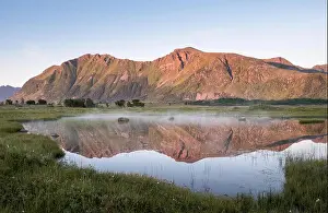 Scenic mountain landscape with nice reflection at bright summer day in Lofoten Island, Norway