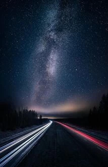 December Collection: Scenic night landscape with milky way and highway