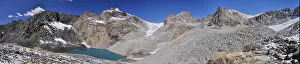 Majestic Mountain Prints: Scenic panorama of lake below highest mountain peaks in Ala Archa national park in Tian Shan mountain range