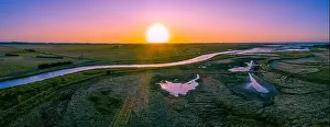 Agricultural Land Prints: Scenic river flowing among meadows and pastures at sunset - wide aerial panorama