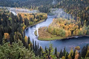 Scenic river landscape with fall colors woodland at autumn morning in National Park, Finland