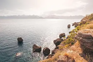 Cliff Mountain Prints: Scenic seascape view with rocks and cliffs in shallow waters