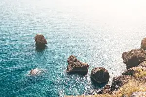 Cliff Mountain Prints: Scenic seascape view with rocks and cliffs in shallow waters