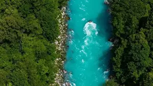 Green Forest Prints: Scenic Summer Aerial Drone View of Soca River in Slovenia