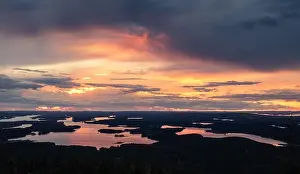 Scenic sunset landscape with high angle view and lakes at autumn evening in Lapland, Finland