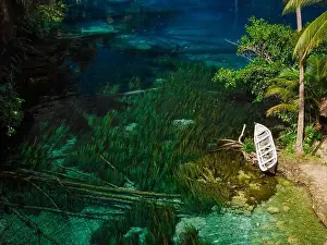 Most scenic tropical lake with transparent blue freshwater in Indonesia. Drone view