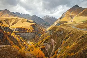 Winding Prints: Scenic valley view in the Caucasus mountains of Georgia with a winding river and golden autumn hills