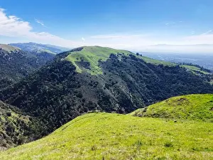 Santa Clara County Prints: A scenic view of Alum Rock Park rugged terrain highlights vibrant grass covered slopes with hiking trails
