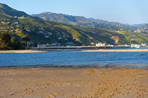 Malibu Prints: Scenic view of Malibu Pier extending over calm waters with sandy beach and hills in background