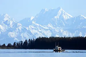 Vessel Prints: Scenic view of the St. Elias Range with a sport fishing boat in the foreground near Yakutat